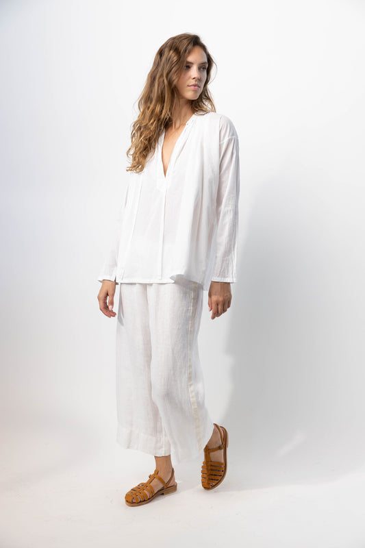 Side view of rice pants with velvet ribbon on model wearing rice top and natural sandals, against a white background.