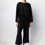 Front view of midnight pants with velvet ribbon on model wearing midnight top and natural sandals, against a white background.