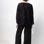 Back view of midnight pants with velvet ribbon on model wearing midnight top and natural sandals, against a white background.