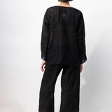 Back view of midnight pants with velvet ribbon on model wearing midnight top and natural sandals, against a white background.