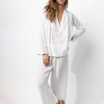 Front view of rice pants with velvet ribbon on model wearing rice top and natural sandals, against a white background.