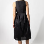 Back view of midnight rajasthani dress on model against a white background.