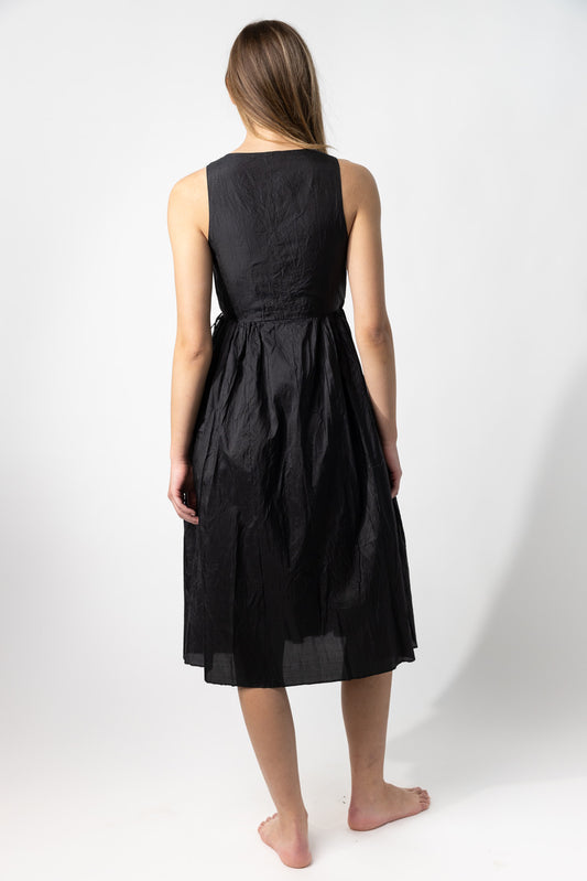 Back view of midnight rajasthani dress on model against a white background.