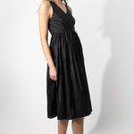 Side view of midnight rajasthani dress on model, against a white background.