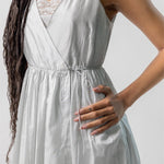 Side closeup view of tint rajasthani dress on model, against a white background.