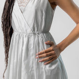 Side closeup view of tint rajasthani dress on model, against a white background.