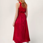 Back view of lipstick rajasthani dress on model wearing red sandals, against a white background.