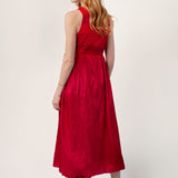 Back view of lipstick rajasthani dress on model wearing red sandals, against a white background.