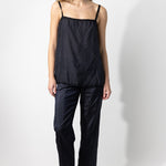 Front view of midnight short chemise on model wearing midnight pants and natural sandals, against a white background.