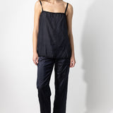 Front view of midnight short chemise on model wearing midnight pants and natural sandals, against a white background.