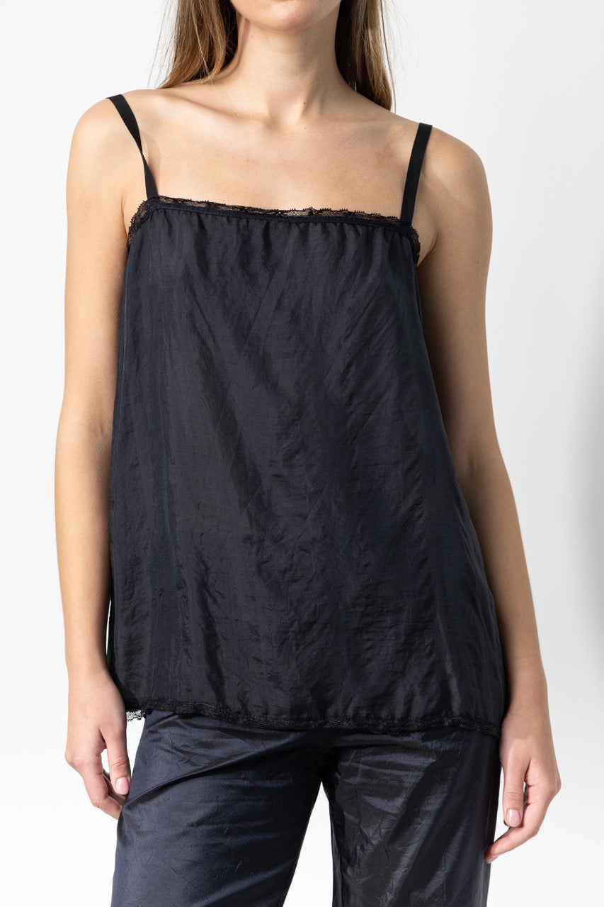 Front closeup view of midnight short chemise on model wearing midnight pants, against a white background.