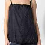 Front closeup view of midnight short chemise on model wearing midnight pants, against a white background.