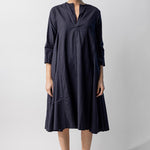 Front view of midnight short tule dress on model wearing natural sandals, against a white background.