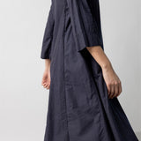Alternate side view of midnight short tule dress on model, against a white background.