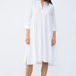 Front view of rice short tule dress on model wearing natural sandals, against a white background.
