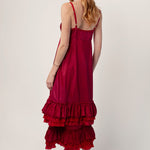 Back view of tibet slip with ruffles on model wearing extra ruffle skirt and red sandals, against a white background.