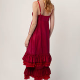 Back view of tibet slip with ruffles on model wearing extra ruffle skirt and red sandals, against a white background.