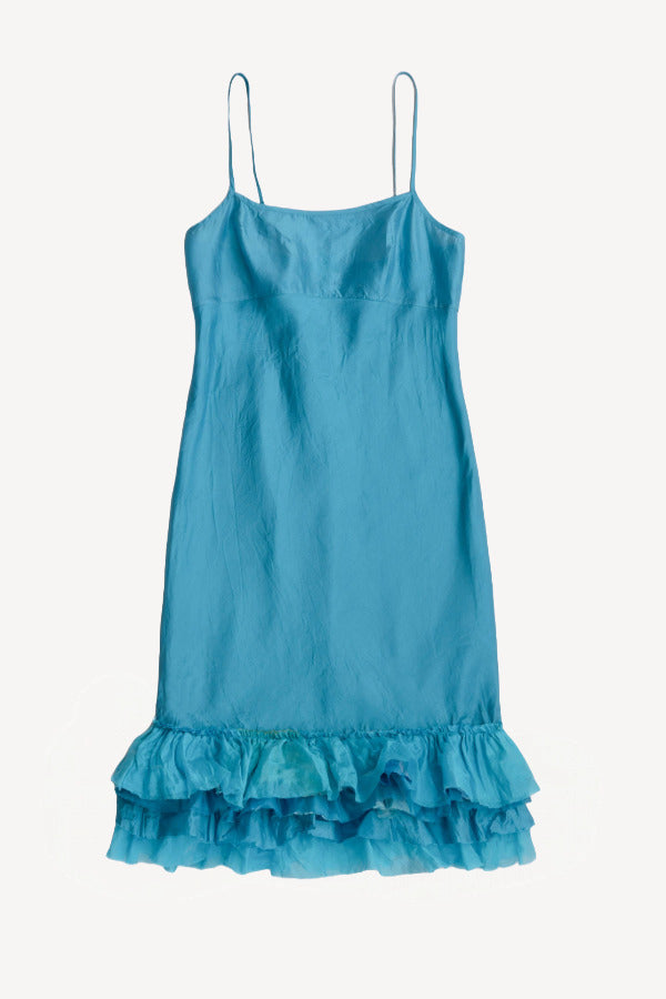 Front view of livadi slip with ruffles on white background, with no model shown.