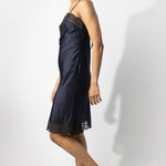 Side view of midight susan slip on model wearing natural sandals, against a white background.