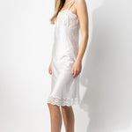 Side view of tint susan slip on model, against a white background.