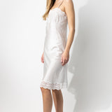 Side view of tint susan slip on model, against a white background.