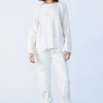Front view of rice tunisian top on model wearing rice pants and natural sandals, against a white background.