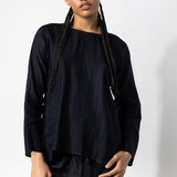 Front view of midnight tunisian top on model wearing midnight pants, against a white background.