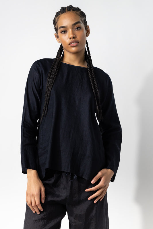 Front view of midnight tunisian top on model wearing midnight pants, against a white background.