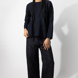 Front view of midnight wide leg pants on model wearing midnight top, against a white background.