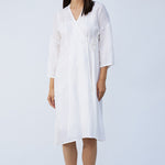 Front view of rice wrap dress on model wearing natural sandals, against a white background.