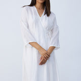Front closeup view of rice wrap dress on model, against a white background.