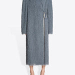 Front view of dark grey Rivla Fringed Coat on model wearing white heels, against a white background.
