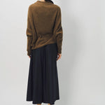 Back view of palissandro cn kimono sleeve sweater on model wearing navy pants, against a white background.