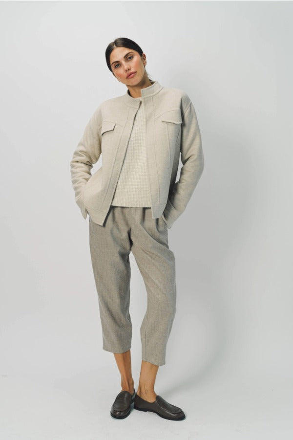 Alternate front view of oatmeal cashmere double face jean jacket on model wearing stone pants, against a white background.