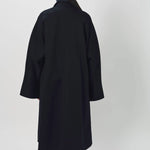 Back view of midnight long kimono coat on model wearing navy pants, against a white background.