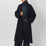 Alternate front view of midnight long kimono coat on model wearing navy turtleneck and pants, against a white background.