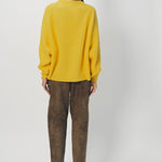 Back view of sunray ls crew neck sweater on model wearing brown pants and loafers, against a white background.