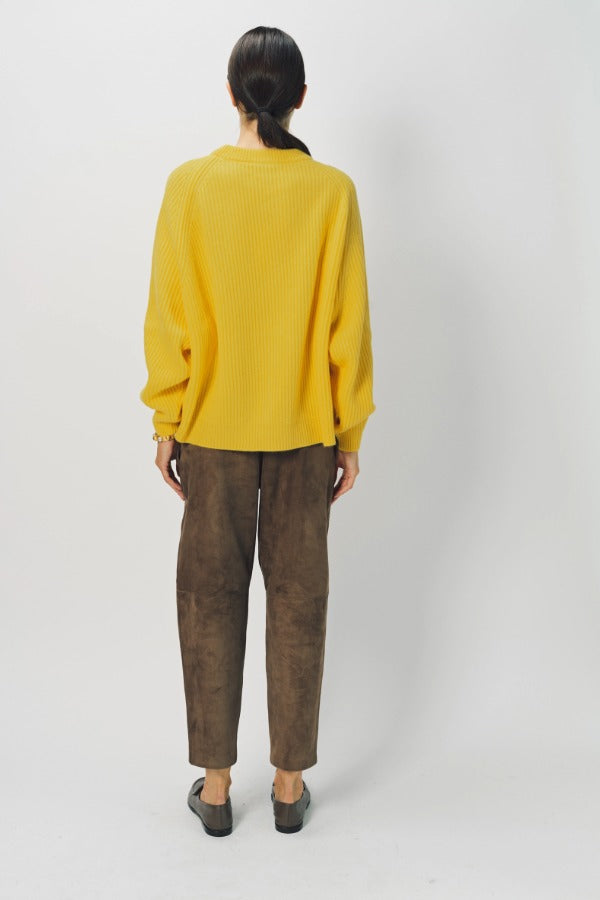 Back view of sunray ls crew neck sweater on model wearing brown pants and loafers, against a white background.
