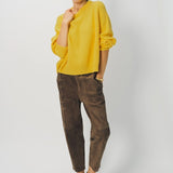 Alternate front view of sunray ls crew neck sweater on model wearing brown pants and loafers, against a white background.