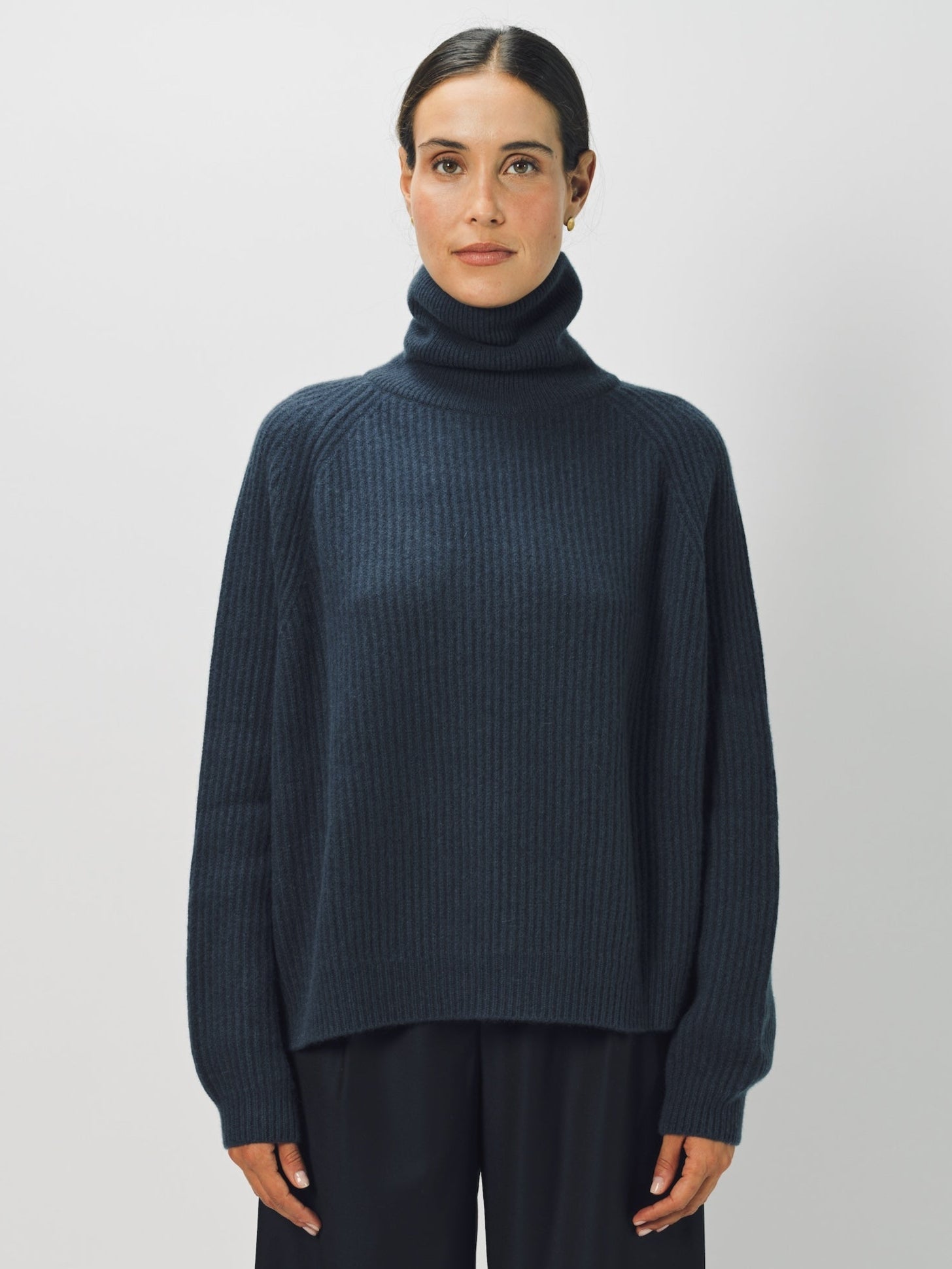 Alternate front view of ls t-neck raglan sweater on model wearing navy pants, against a white background.