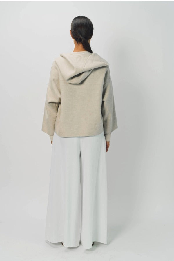 Back view of white cotton gaucho pant on model wearing vanilla top, against a white background.