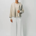Front view of white cotton gaucho pant on model wearing vanilla top, against a white background.