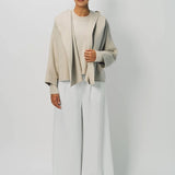Front view of white cotton gaucho pant on model wearing vanilla top, against a white background.