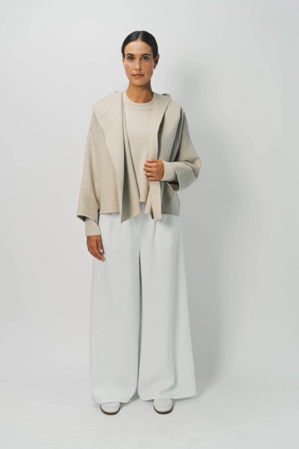 Front view of white cotton gaucho pant on model wearing vanilla top, against a white background.