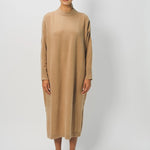 Front view of bronzo iconic cashmere dress on model wearing loafers, against a white background.