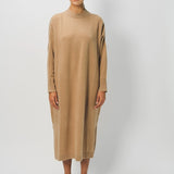 Front view of bronzo iconic cashmere dress on model wearing loafers, against a white background.