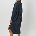 Alternate side view of pacific iconic cashmere dress on model wearing loafers, against a white background.