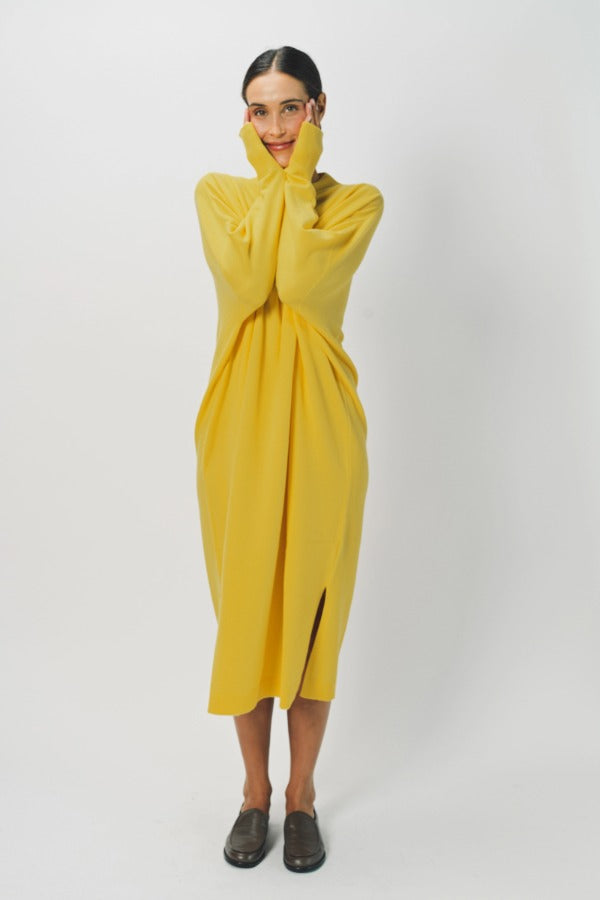 Alternate front view of sunray iconic cashmere dress on model wearing loafers, against a white background.