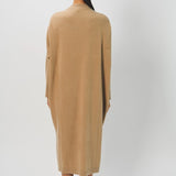 Back view of bronzo iconic cashmere dress on model wearing loafers, against a white background.