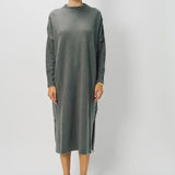Front view of storm iconic cashmere dress on model wearing loafers, against a white background.